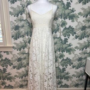 Absolutely stunning lace gown.  Size 2.  Purchased in a San Francisco boutique.